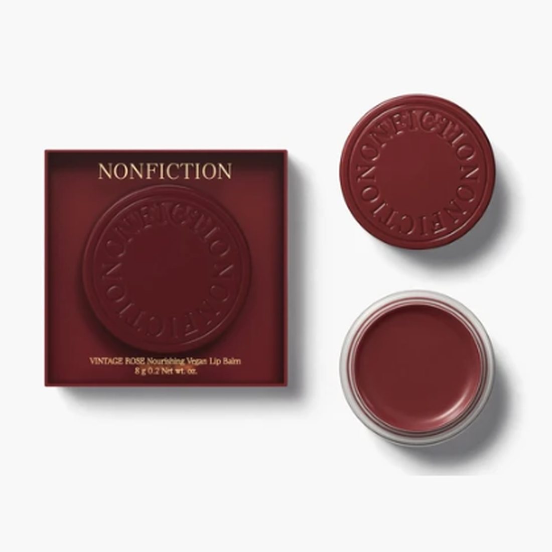 Vintage Rose Vegan Lip & Cheek Balm in a deep burgundy case with an embossed lid, shown beside the open balm.